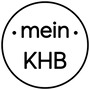 Ein kreisförmiges Logo mit dem Text "mein" oben, flankiert von zwei Punkten, und "KHB" unten, alles in grauen Buchstaben auf weißem Hintergrund.