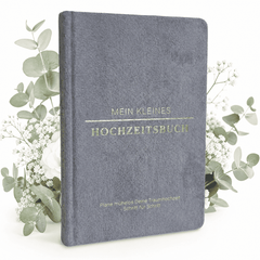 Das "Mein kleines Hochzeitsbuch - Eleganter Nebel" von Mein kleines Hochzeitsbüro mit goldener Schrift steht zwischen weißen Blumen auf weißem Hintergrund - der perfekte Start für eure Hochzeitsplanung.