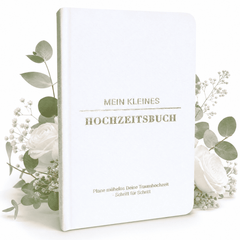 Mein kleines Hochzeitsbuch - Ewige Eleganz von Mein kleines Hochzeitsbüro: ein stilvolles weißes Hochzeitsbuch mit goldener Schrift, umgeben von weißen Rosen und Eukalyptus - ein eleganter Begleiter für die Hochzeitsplanung.